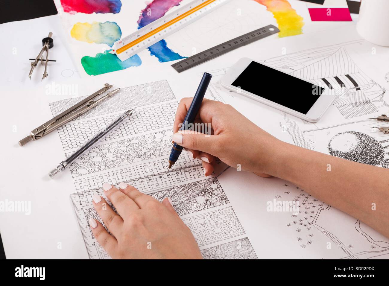 Creative Process in a Collage Set of Colorful Drawings and Tools on a Workspace Table Stock Photo