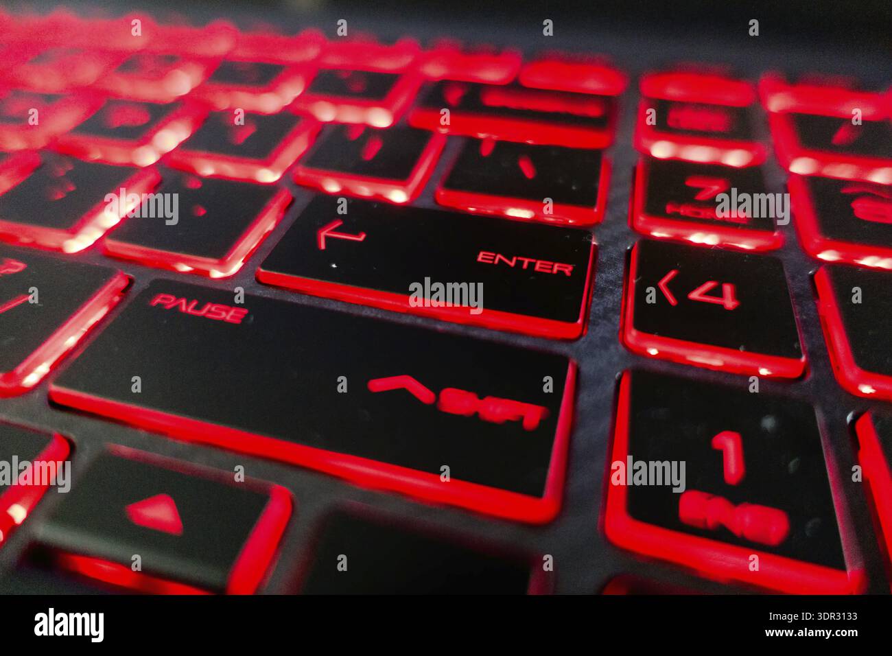 Red lights keyboard keys on black keyboard Stock Photo