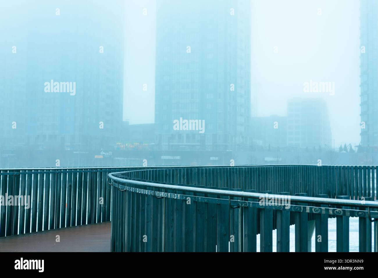 Morning Railing Shot Urban landscape featuring a curved modern metal railing on a pedestrian ...