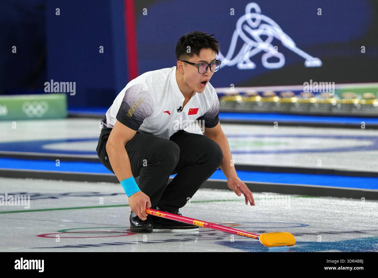 China's Li Zhichao reacts during the men's curling round robin session ...