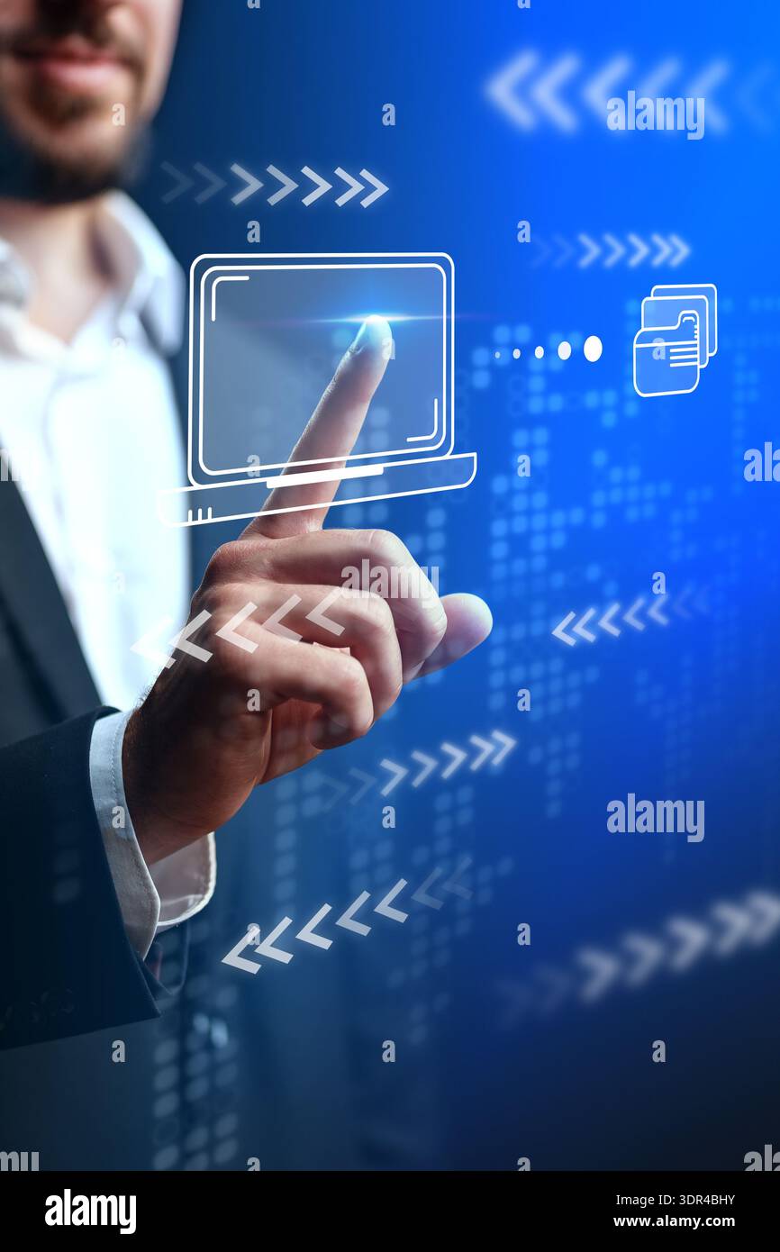 Person interacts with digital screen in business setting during daytime Stock Photo