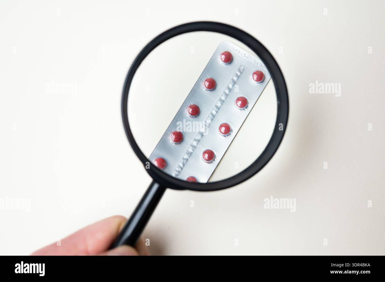 Precise Visual Inspection Focus On Verifying Authenticity Of Pharmaceutical Products Stock Photo