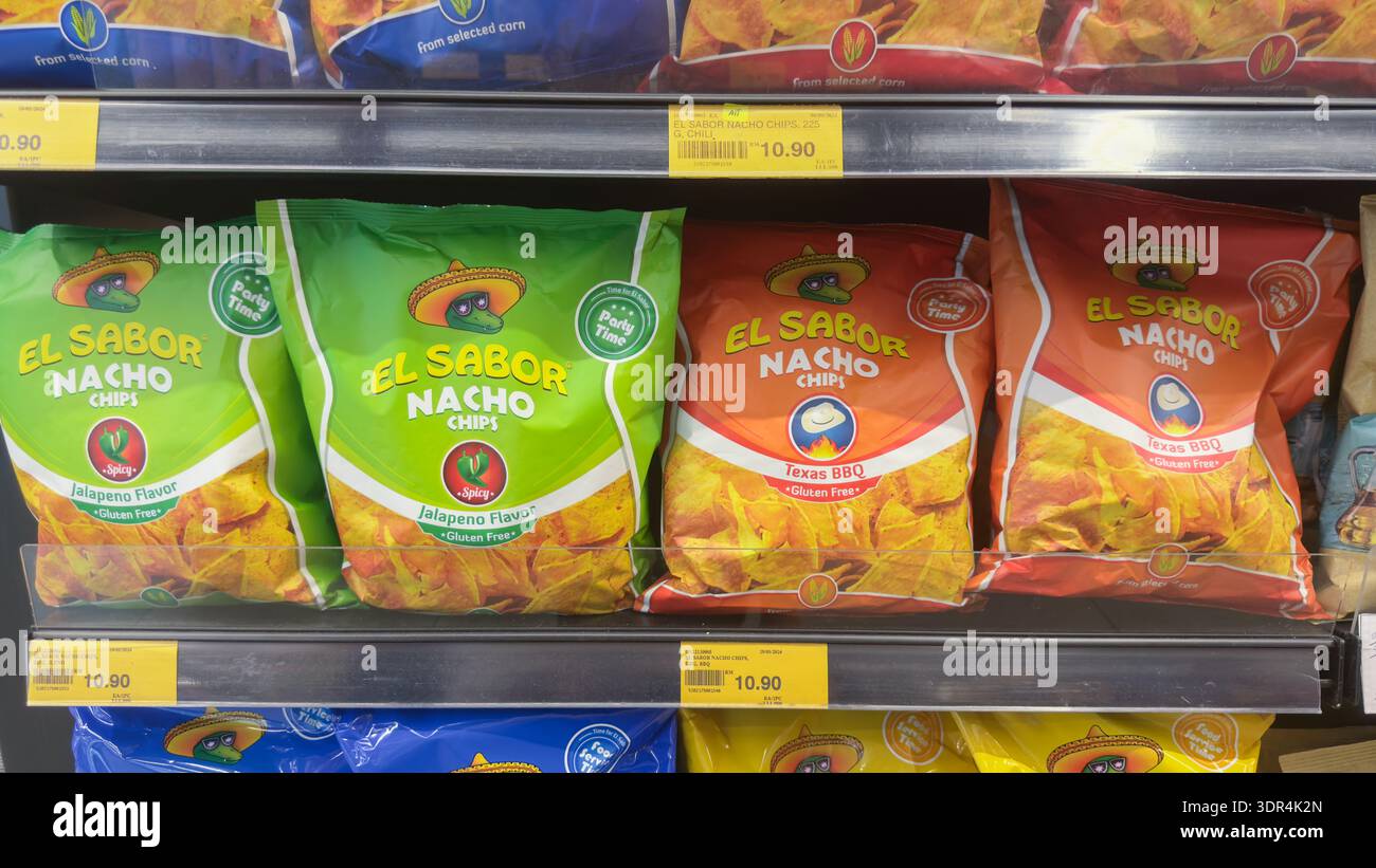 Penang, Malaysia – April 17, 2025: Bags of El sabor nacho chips in various flavors are displayed on a supermarket shelf, highlighting vibrant packagin Stock Photo