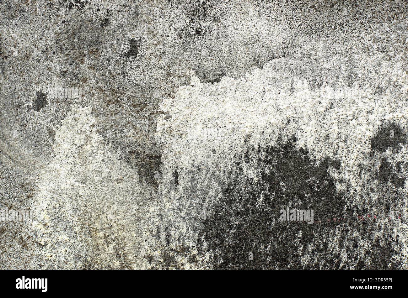 Old grey wall with weathered surface. Abstract patterns on the wall Stock Photo