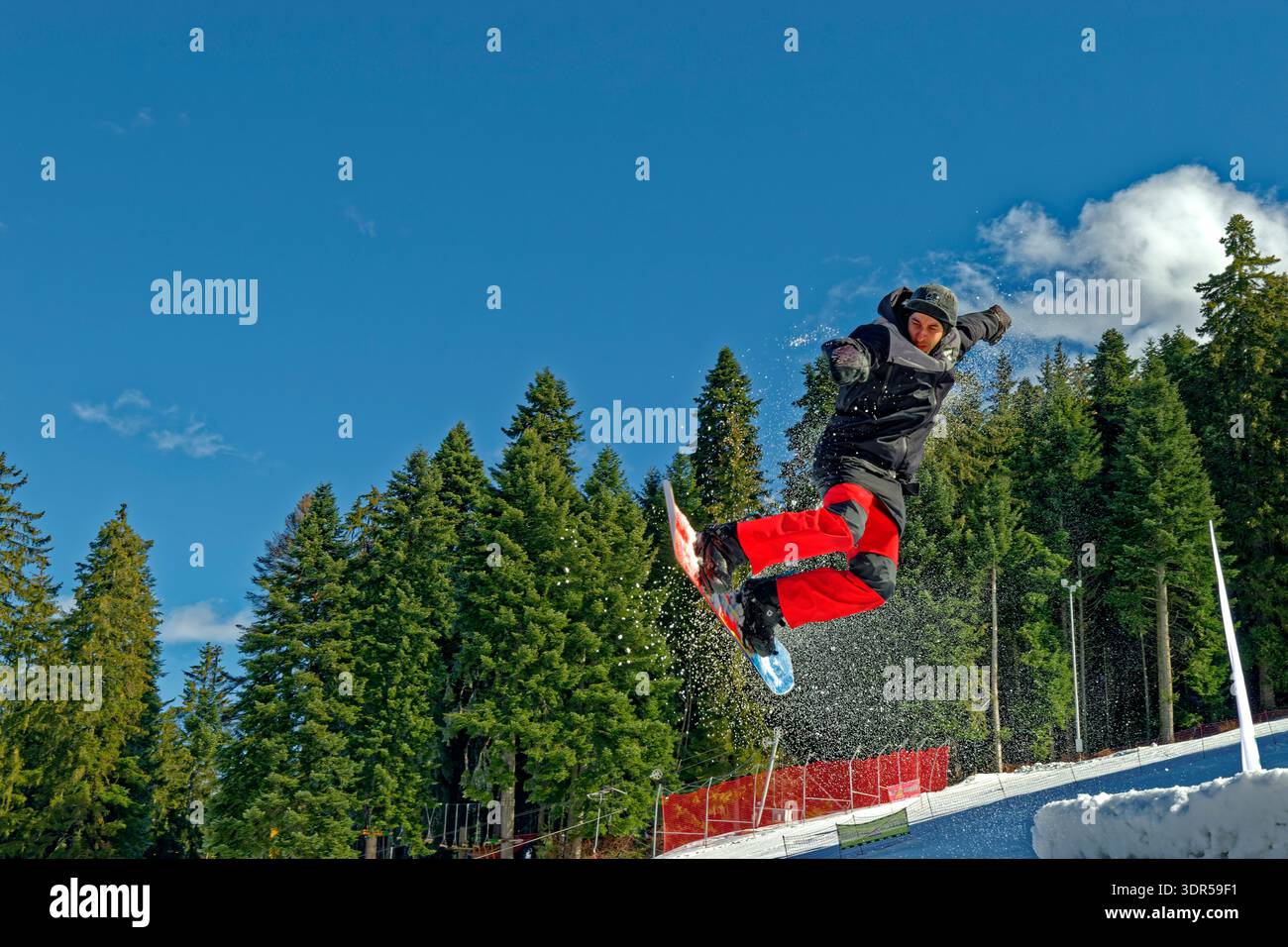 Snowboarder in the air. Stock Photo