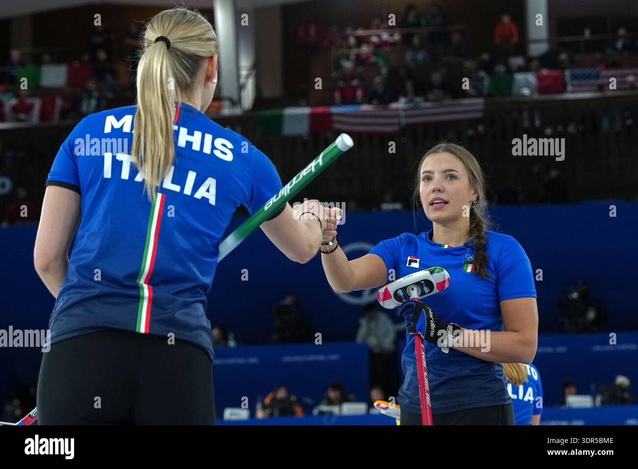Italy's Giulia Zardini Lacedelli and Elena Mathis bump fists during the ...