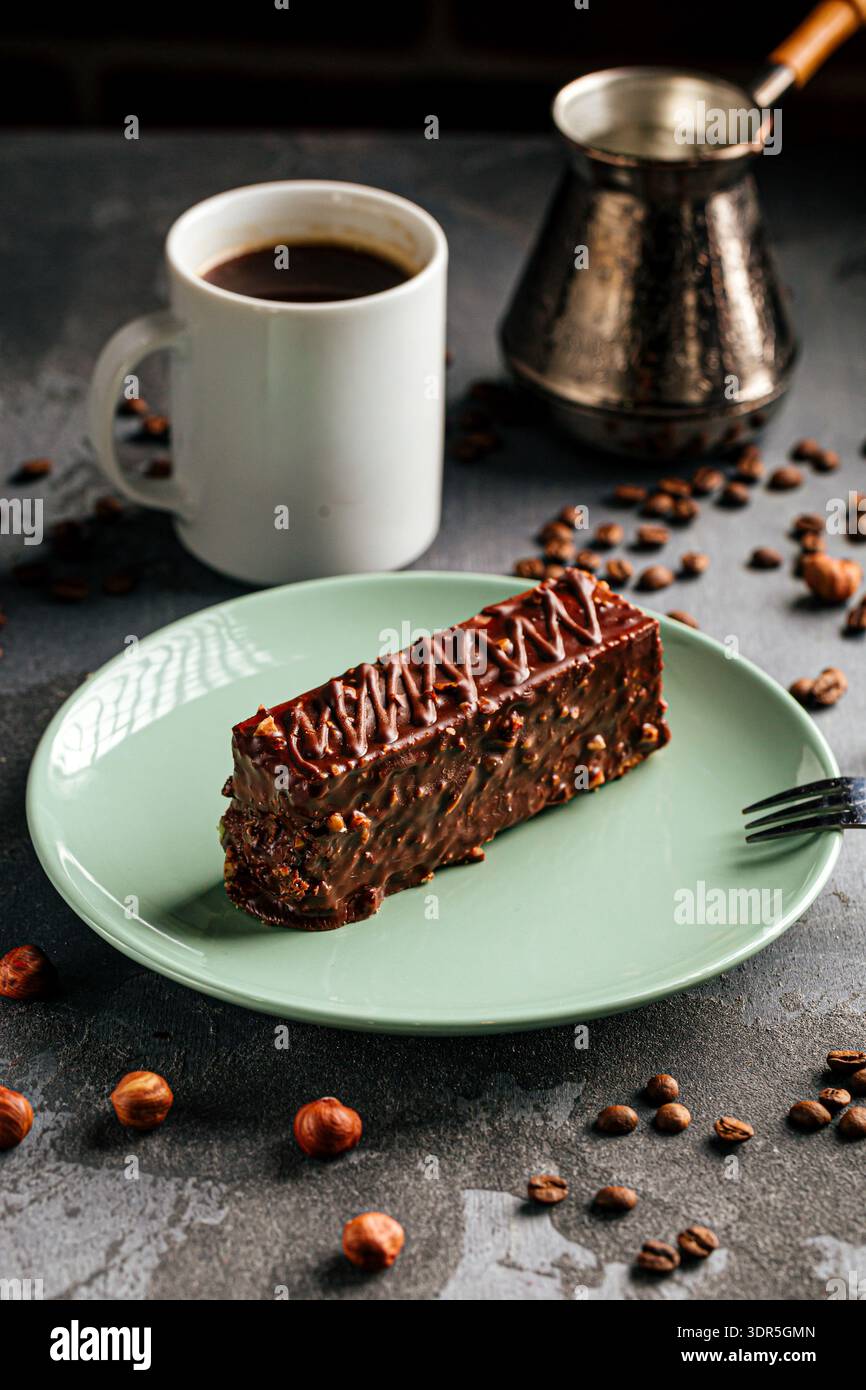 Chocolate nut cake slice with coffee cup Stock Photo