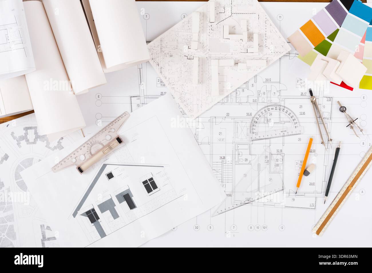 Collection of Architectural Plans and Models on a Table for Design and ...
