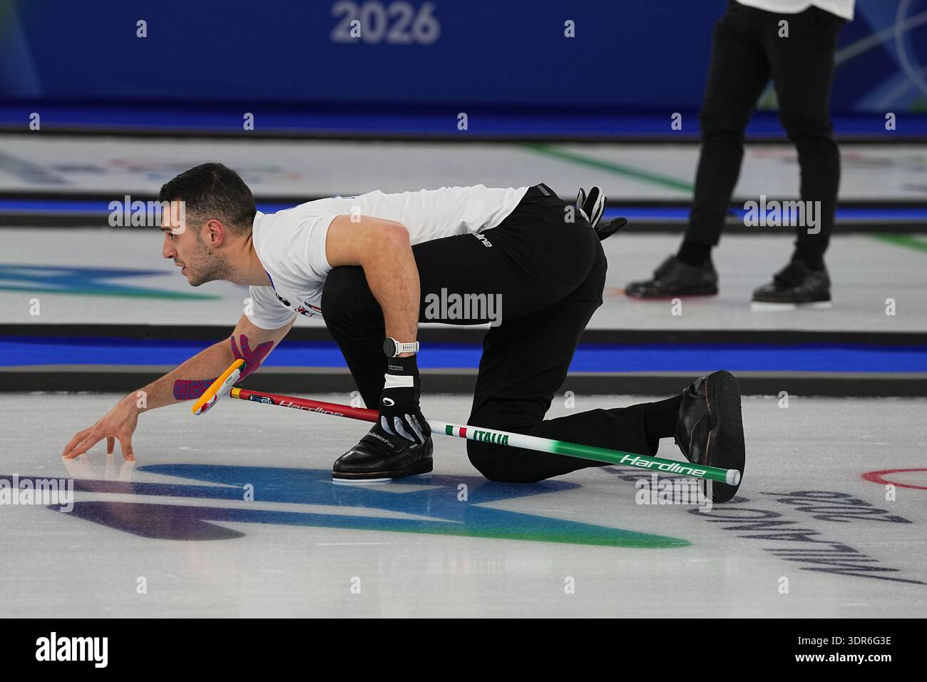 Italy's Sebastiano Arman in action during the men's curling round robin ...