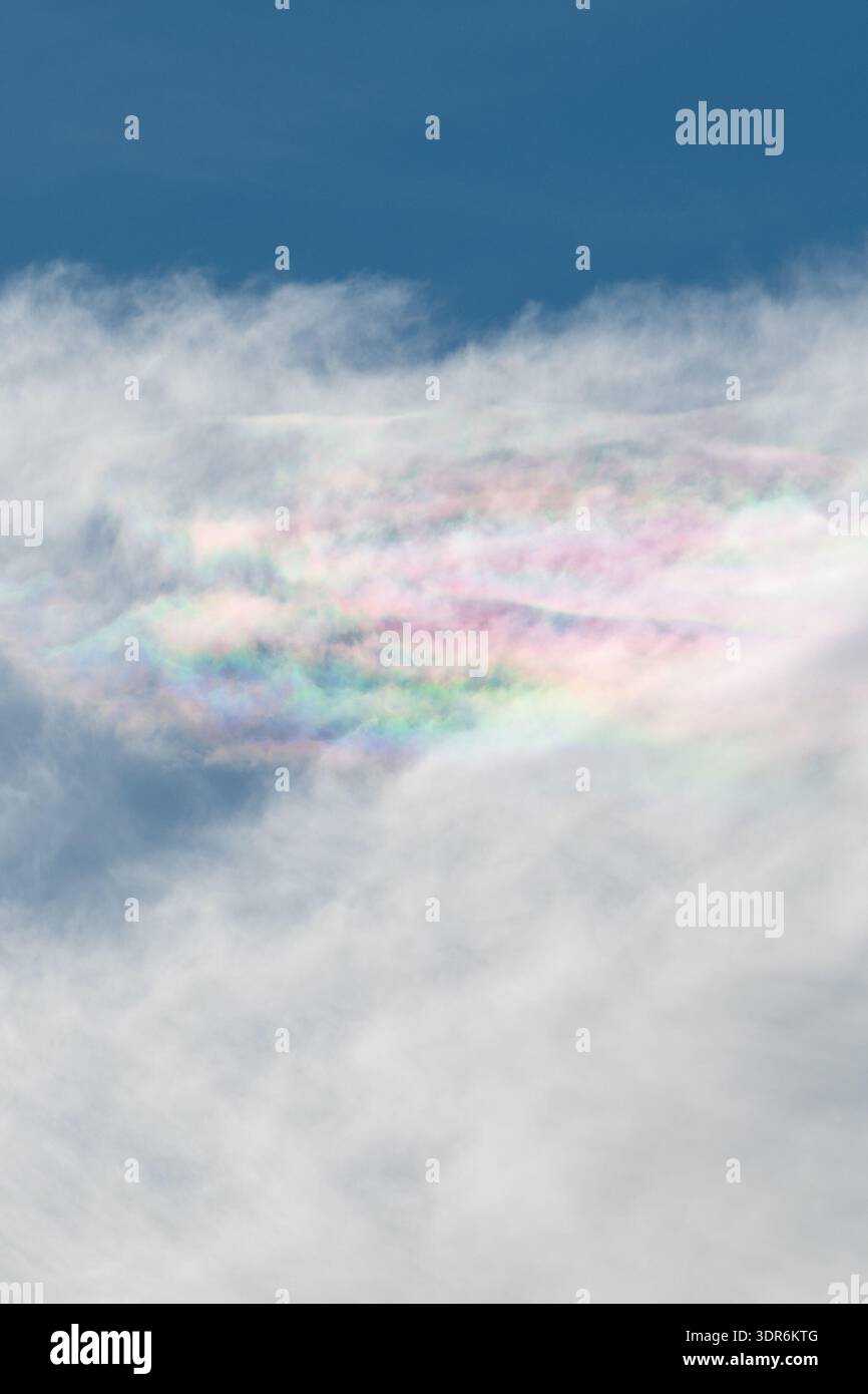 Iridescent clouds, also known as rainbow clouds Stock Photo