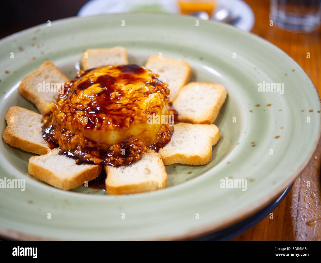Gourmet sweet potato timbale with traditional Canarian almogrote cheese and a drizzle of palm honey Stock Photo