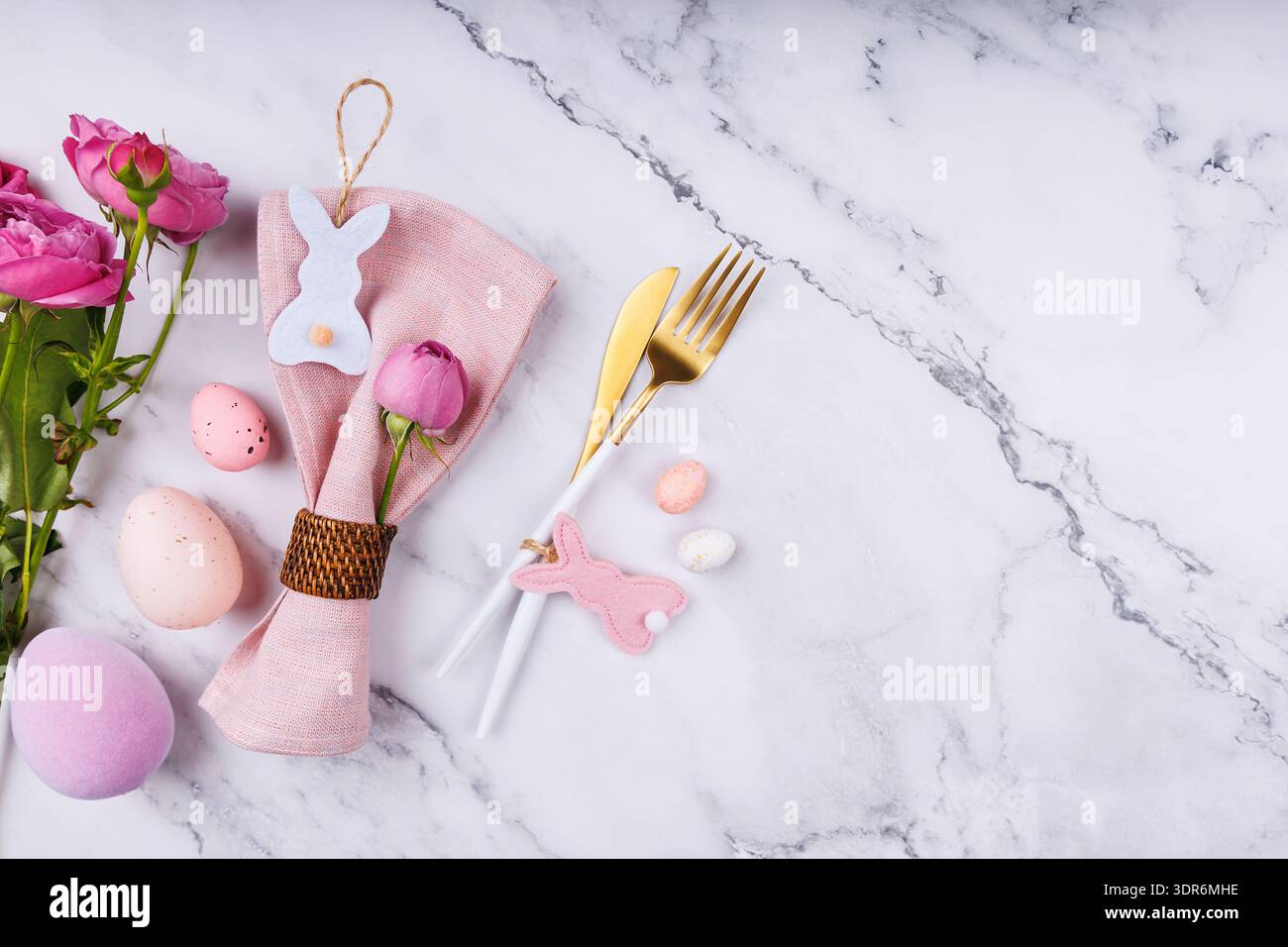 Spring Table Decor with Bunny Ornaments and Roses Stock Photo