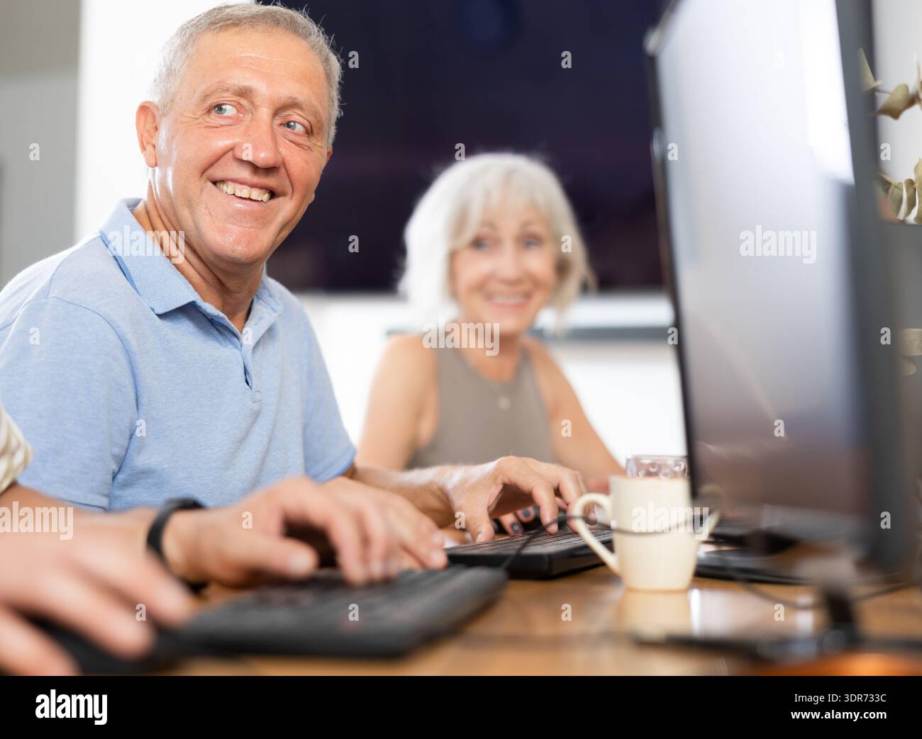 Group of older people studying on computer course Stock Photo