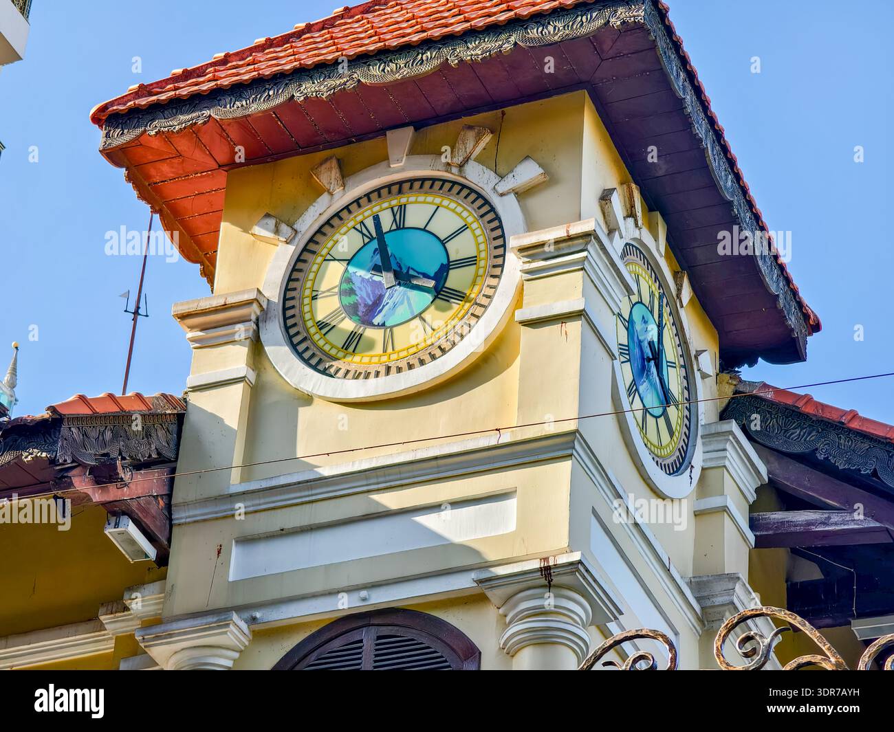 Colonial Clocktower Building Historical colonial small building with clock tower among the modern ...