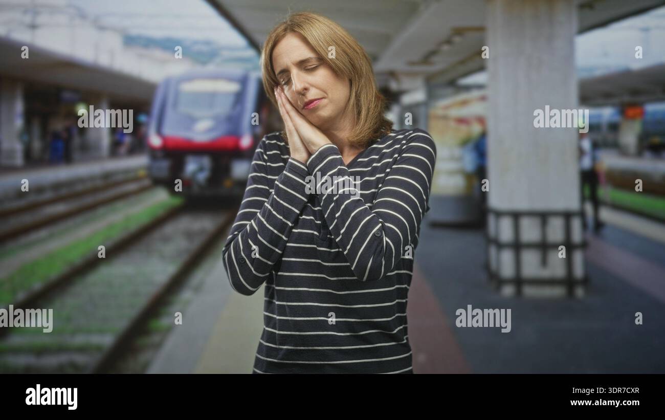 A woman sleeping on a train hi-res stock photography and images - Alamy