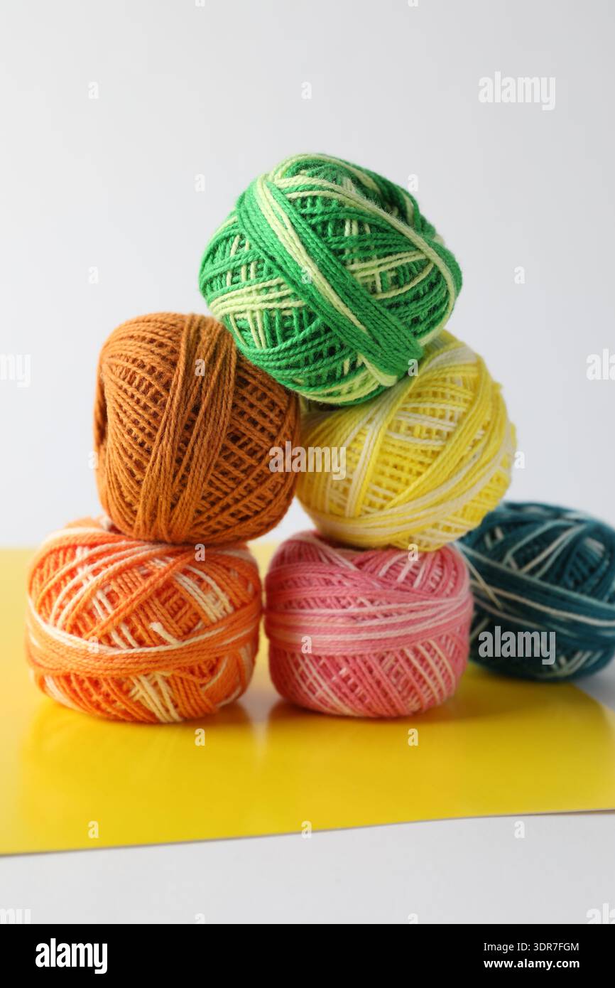 Many different spools of thread on light grey background, closeup Stock Photo