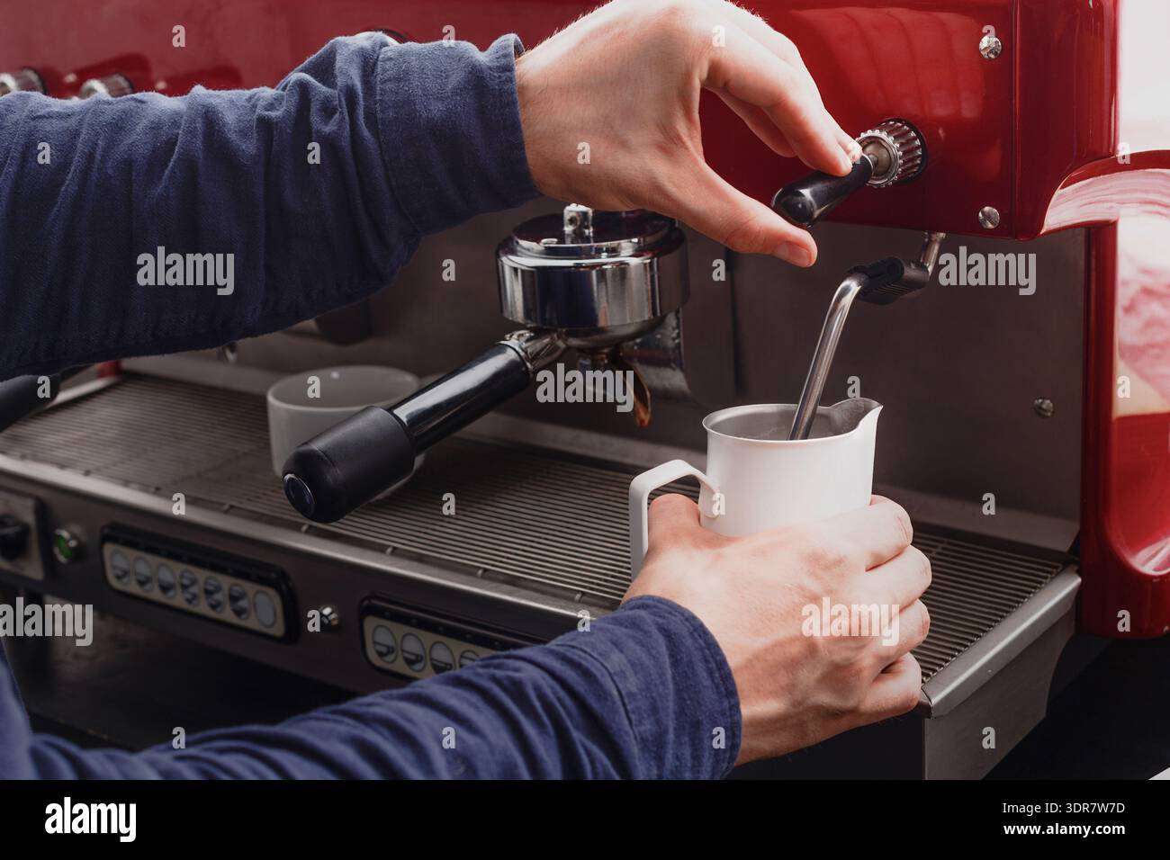 Coffee Preparation Process in a Cafe Using an Espresso Machine With Milk Steaming Stock Photo