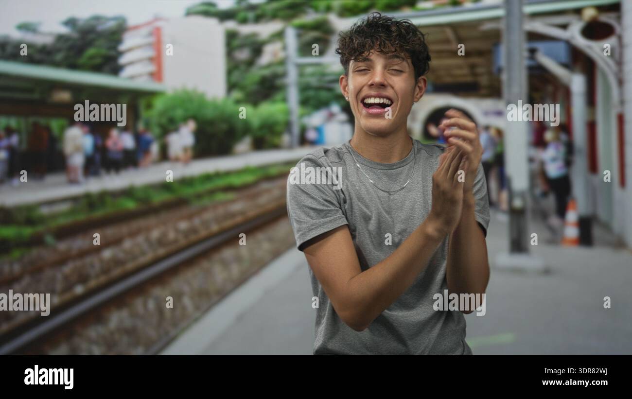Teenage man clapping hands hi-res stock photography and images - Alamy