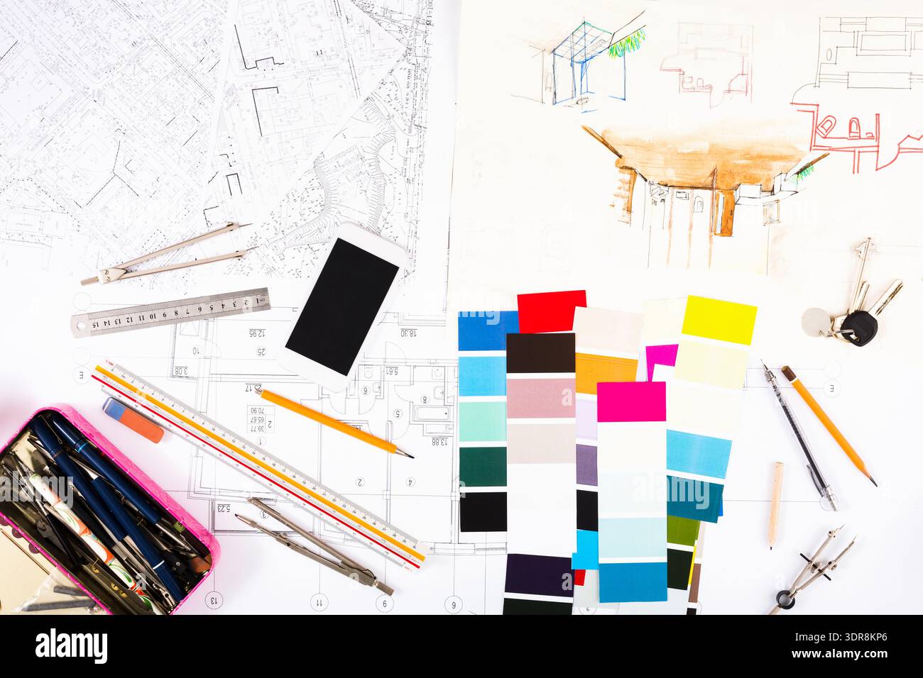 Collection of Design Elements and Tools on a Table for Architectural Projects Stock Photo