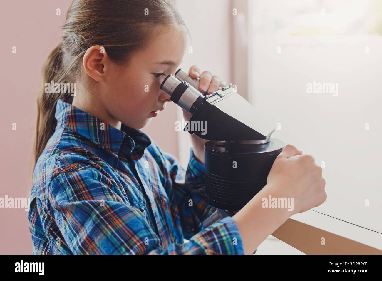 Kids Learn Science Through Hands-On Activities With a Projector in a Classroom Setting Stock Photo