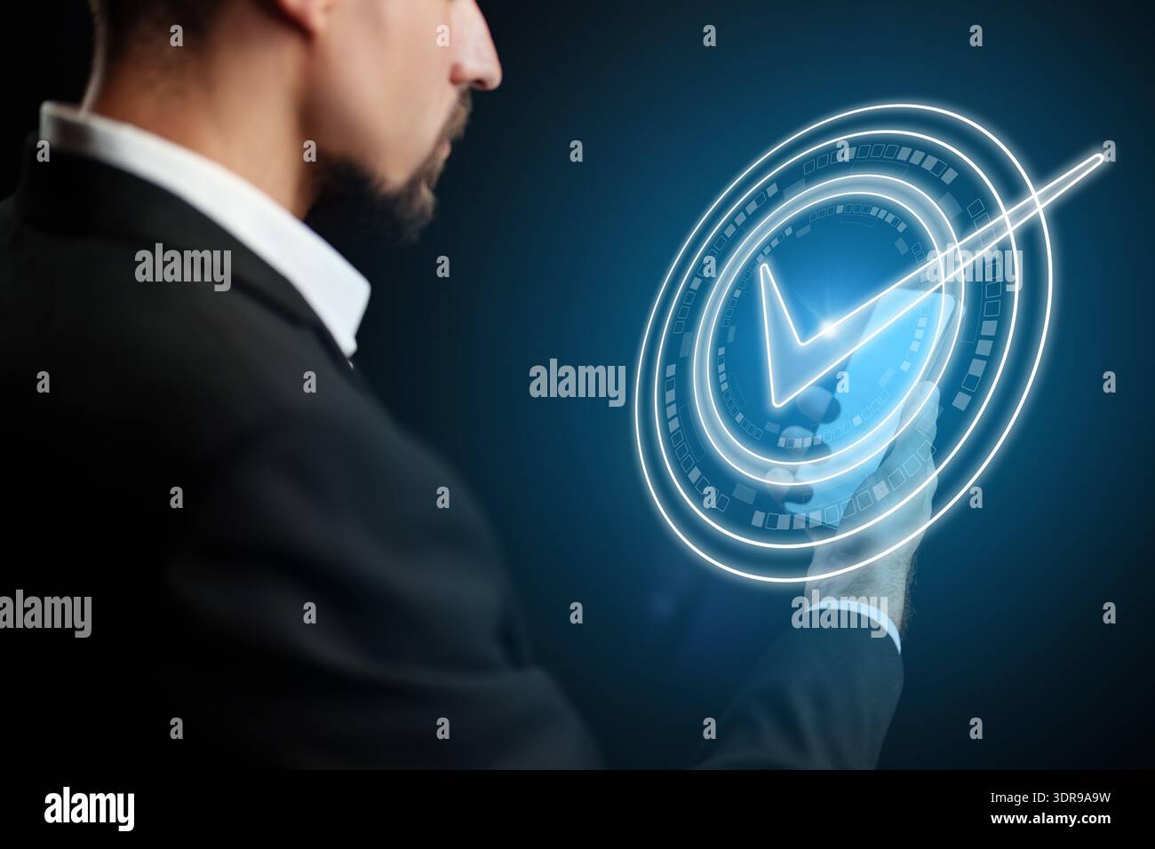 Man using digital interface to confirm banking invoice payment in a modern setting Stock Photo