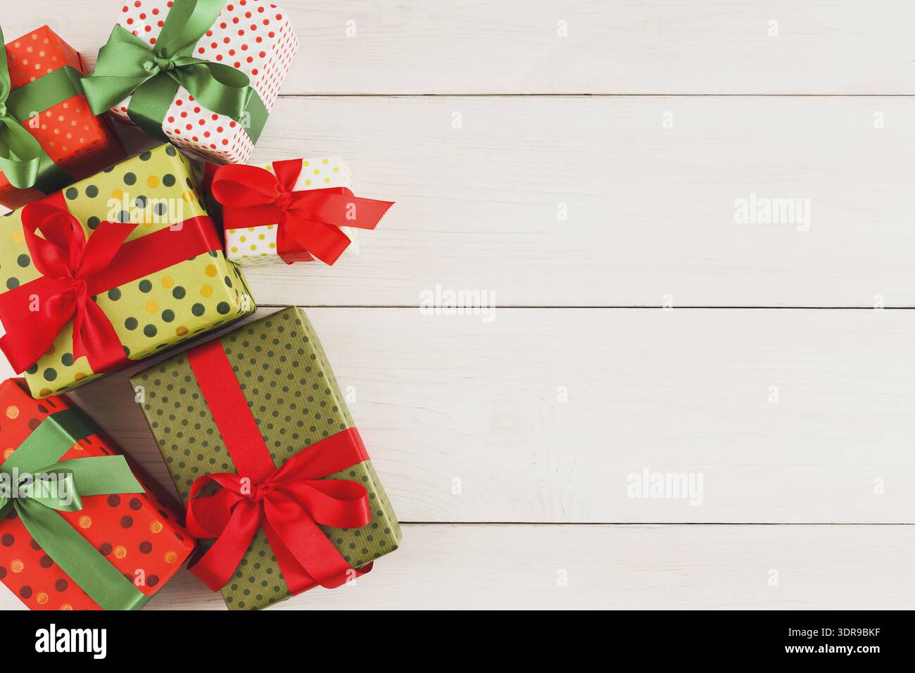 Colorful Set of Gift Boxes Arranged on a Wooden Surface for a Special Occasion or Celebration Event Stock Photo