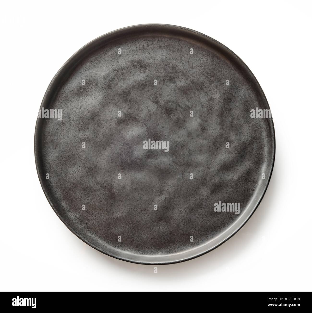 empty black plate isolated on white background, top view Stock Photo