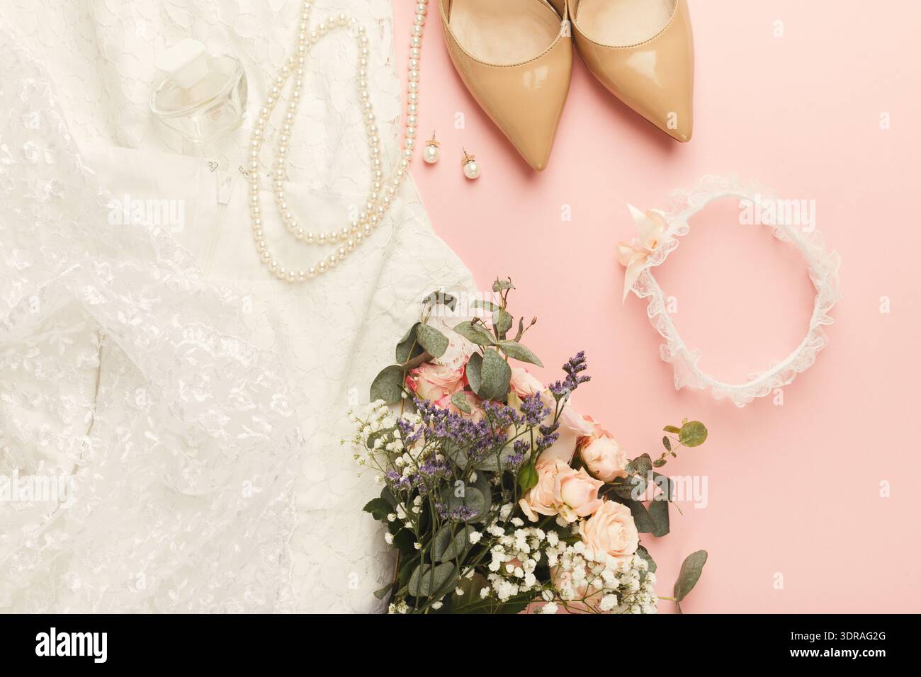 Collection of Wedding Items Including Dress, Shoes, and Flowers on Pink  Background Stock Photo - Alamy