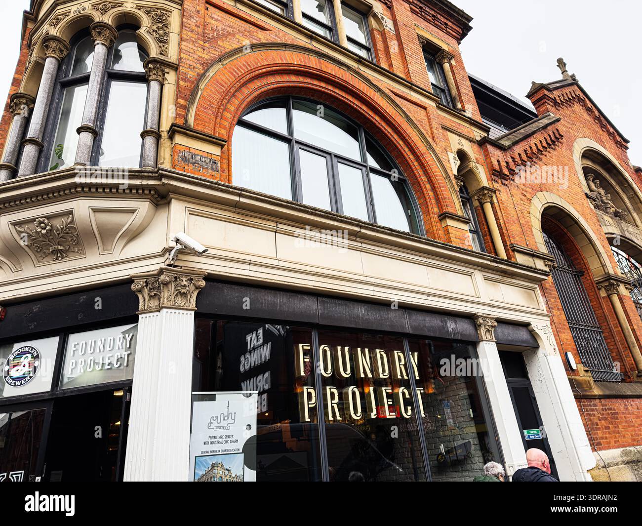 Manchester, UK - January 26, 2026: Historic brick facade frames the ...