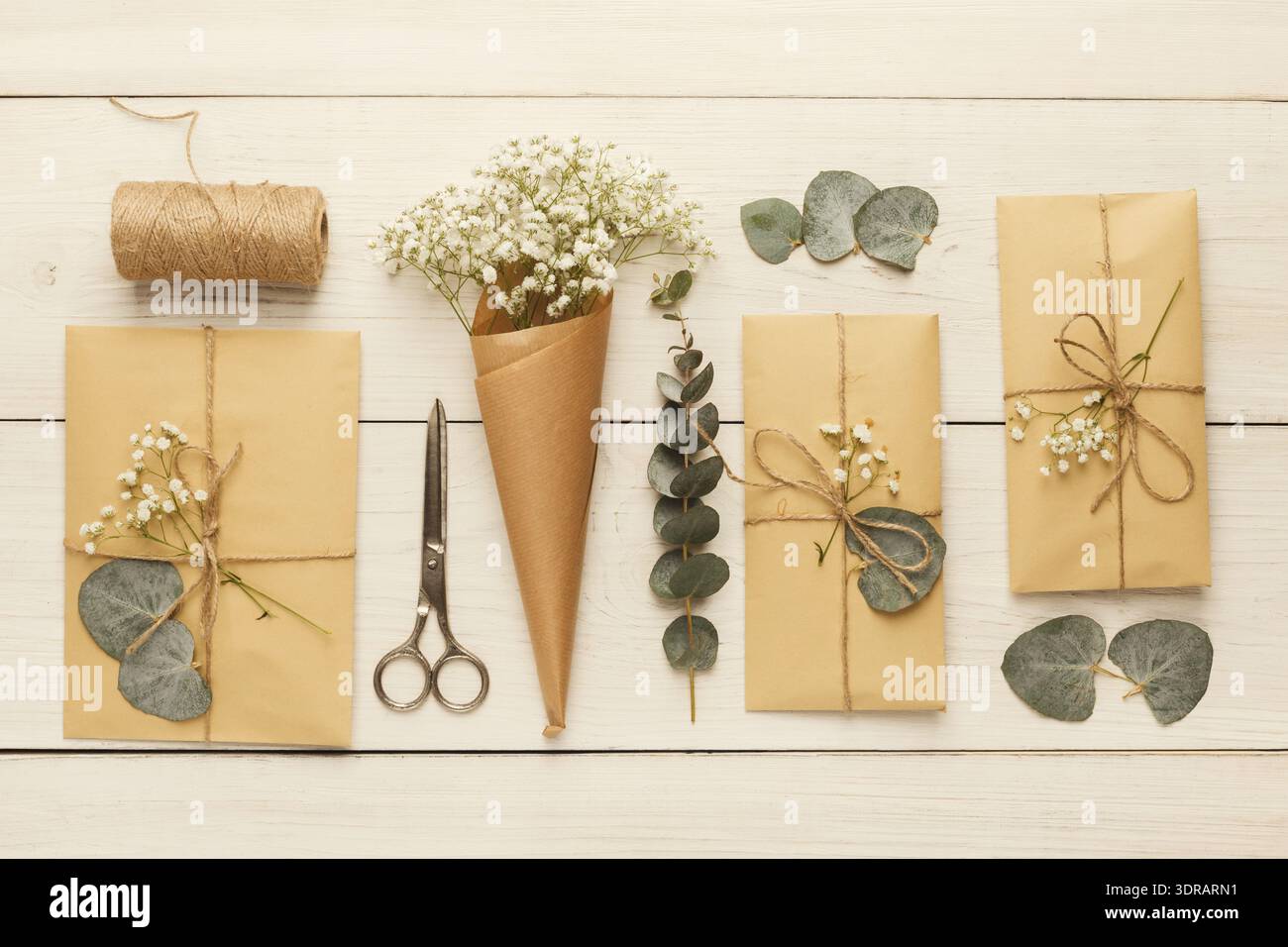 Gift Wrapping Setup With Natural Elements on a Wooden Table Stock Photo