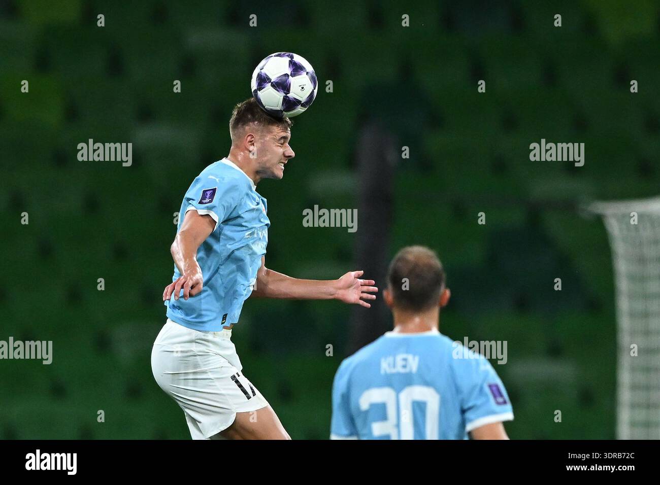 Max Caputo of Melbourne City (left) headers the ball during the AFC ...