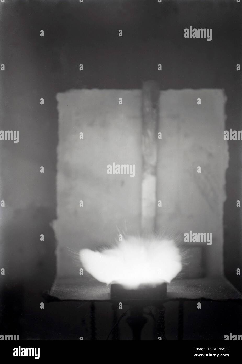 A photograph from circa 1900–1906 captures a magnesium test experiment ...