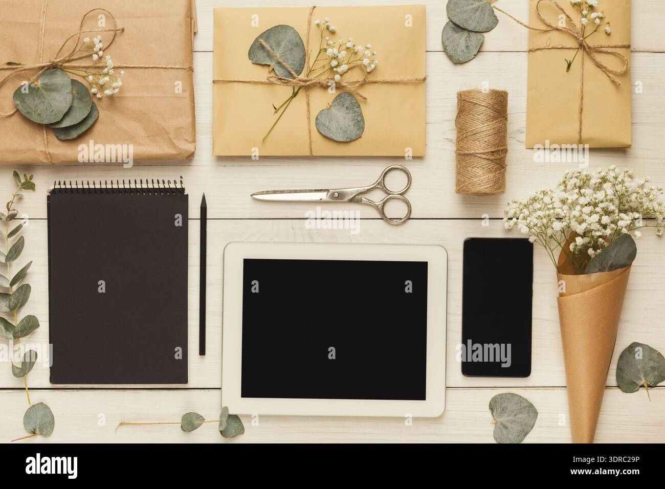 Gift Wrapping Setup on a Table With Tools and Materials for Crafting Stock Photo