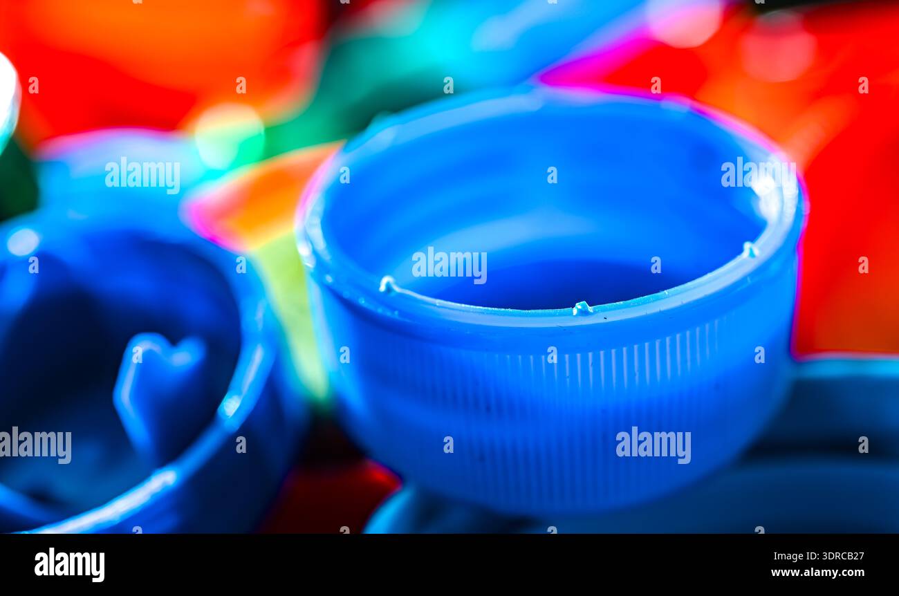 Different sorts of colorful plastic bottle caps. Recycling. Stock Photo