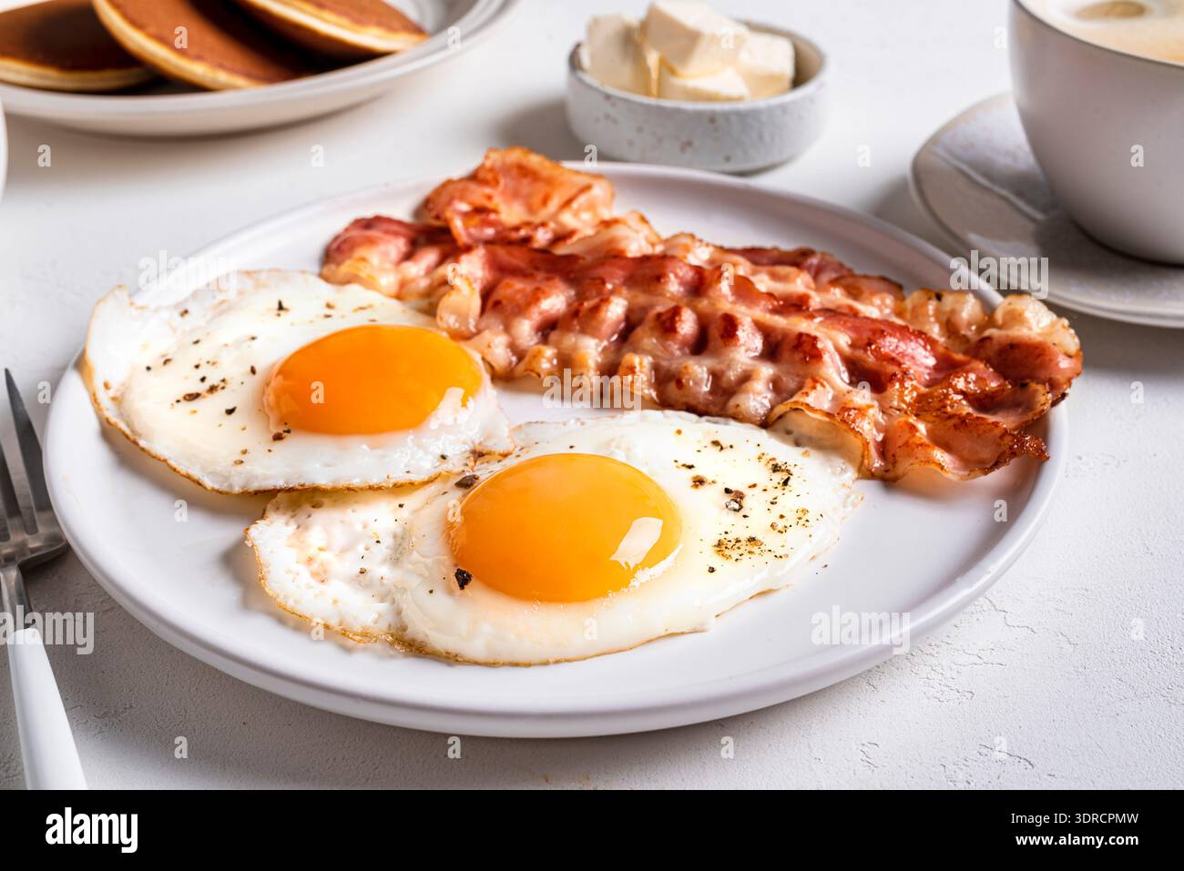 Breakfast with fried eggs and bacon Stock Photo