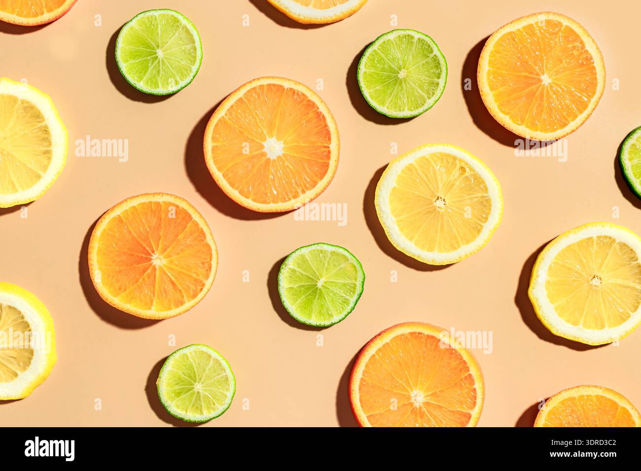 Citrus fruit slices pattern, orange, lemon, lime. Stock Photo