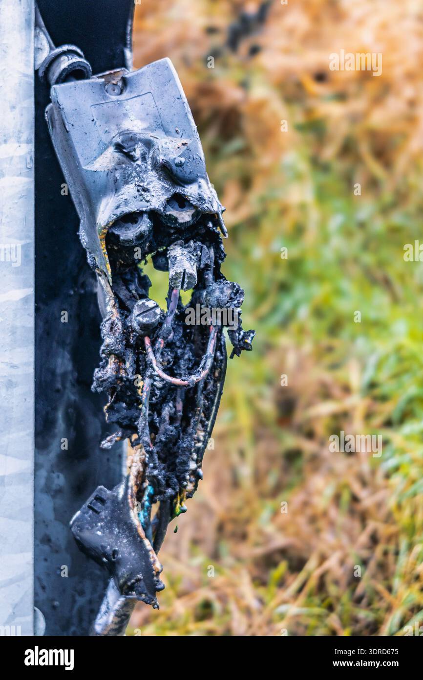 Short circuit in electrical system and its consequences Burnt cable junction box Stock Photo