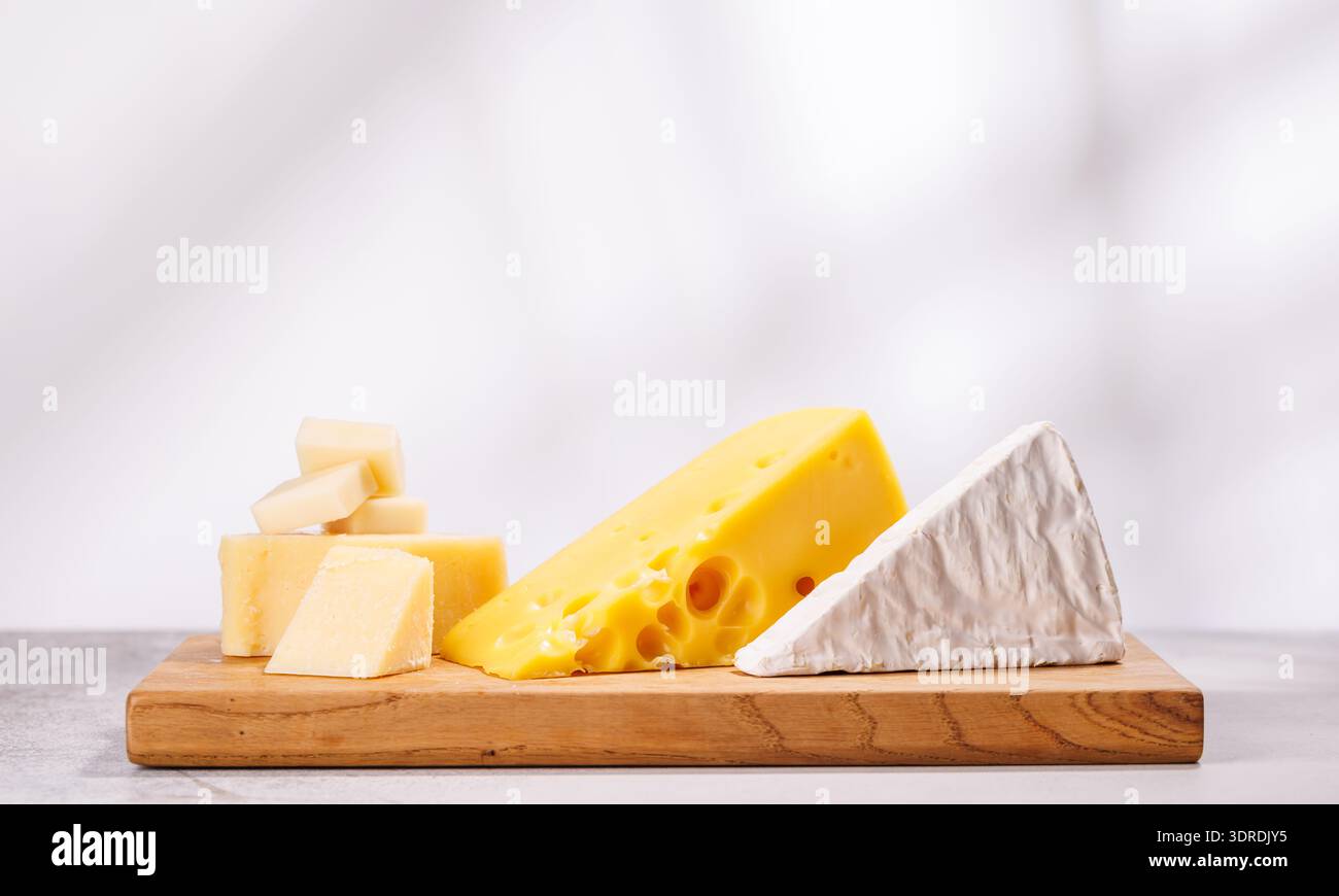 A delectable arrangement of various cheeses Stock Photo