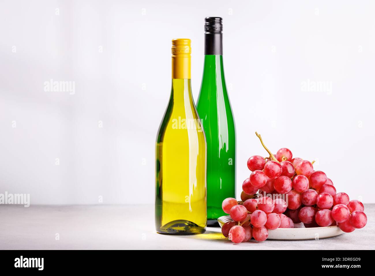 A delectable arrangement of various wine and grapes Stock Photo