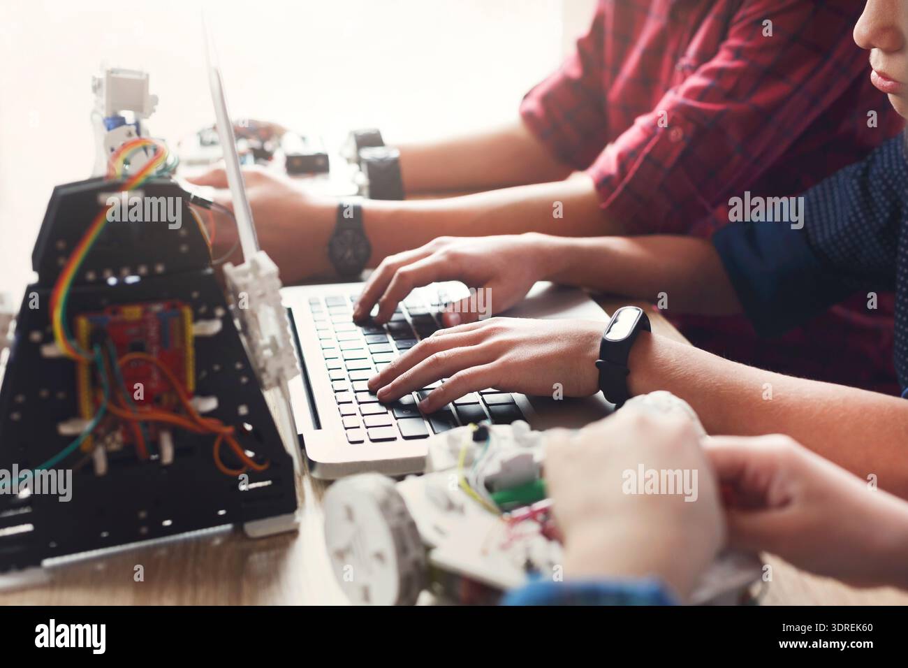 Students Build Robots and Code Programs During a Workshop at a Community Center in the Afternoon Stock Photo
