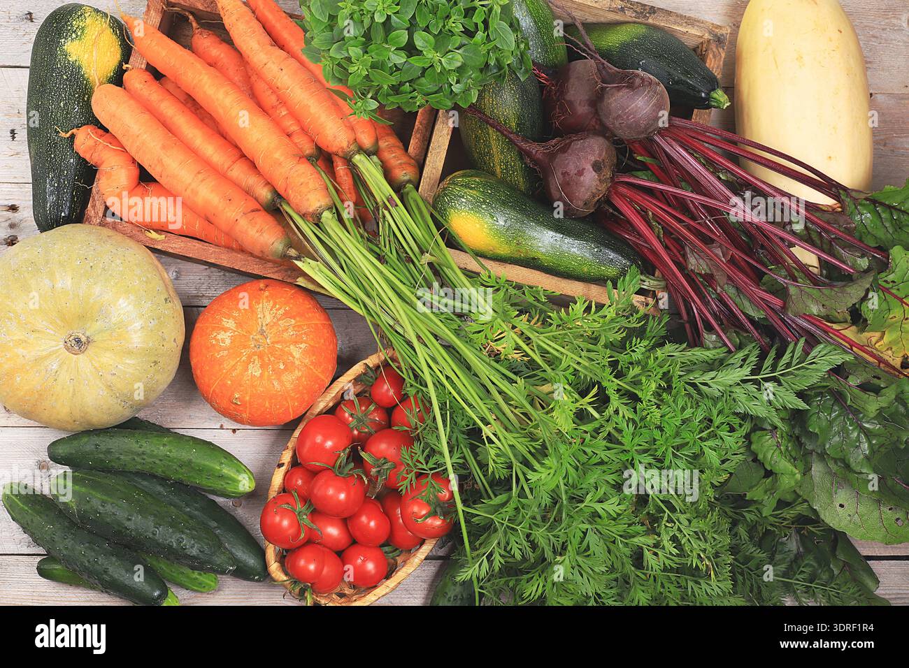 Healthy natural products on wooden table, healthy lifestyle concept.Fresh vegetables, carrots, beets, cucumbers, tomatoes and pu Stock Photo
