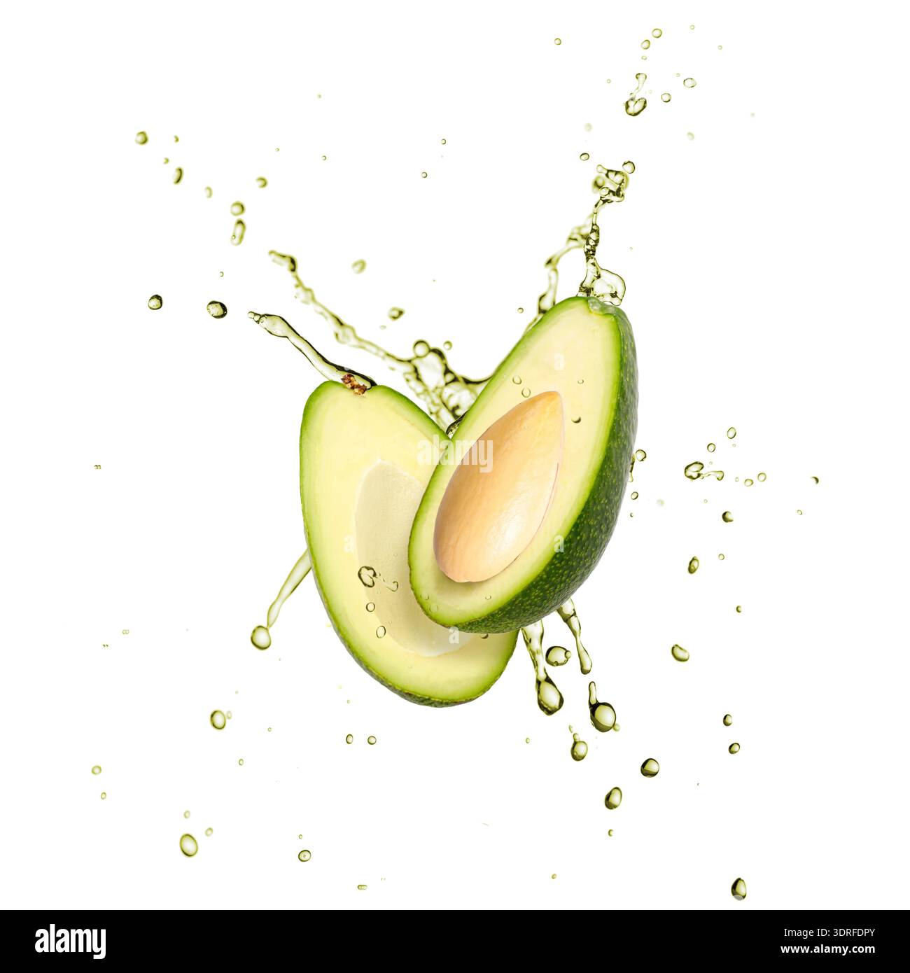 Sliced green avocado flying in splashing drink juice isolated on white background Stock Photo