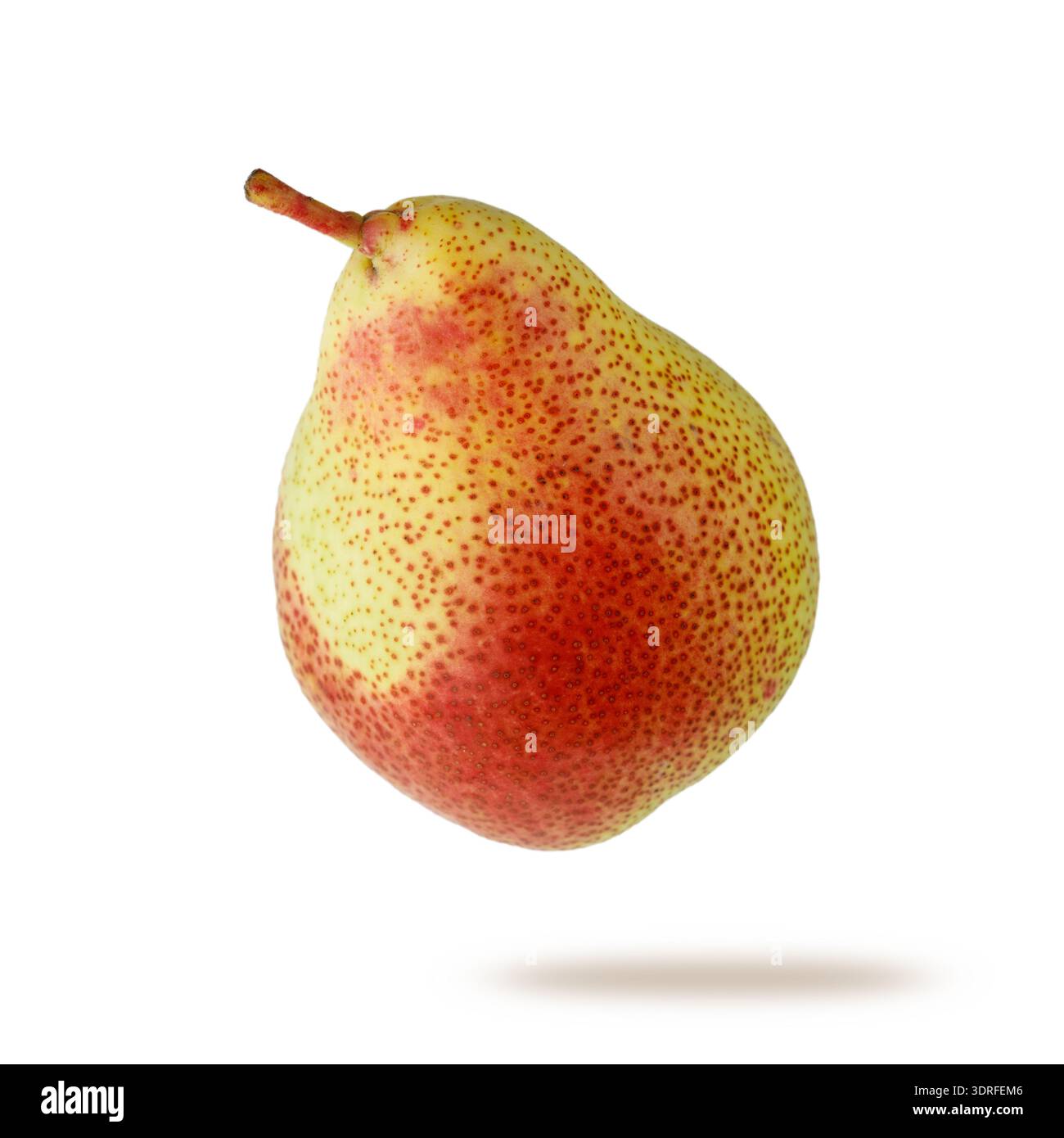 Single fresh red green pear flying isolated on white background Stock Photo