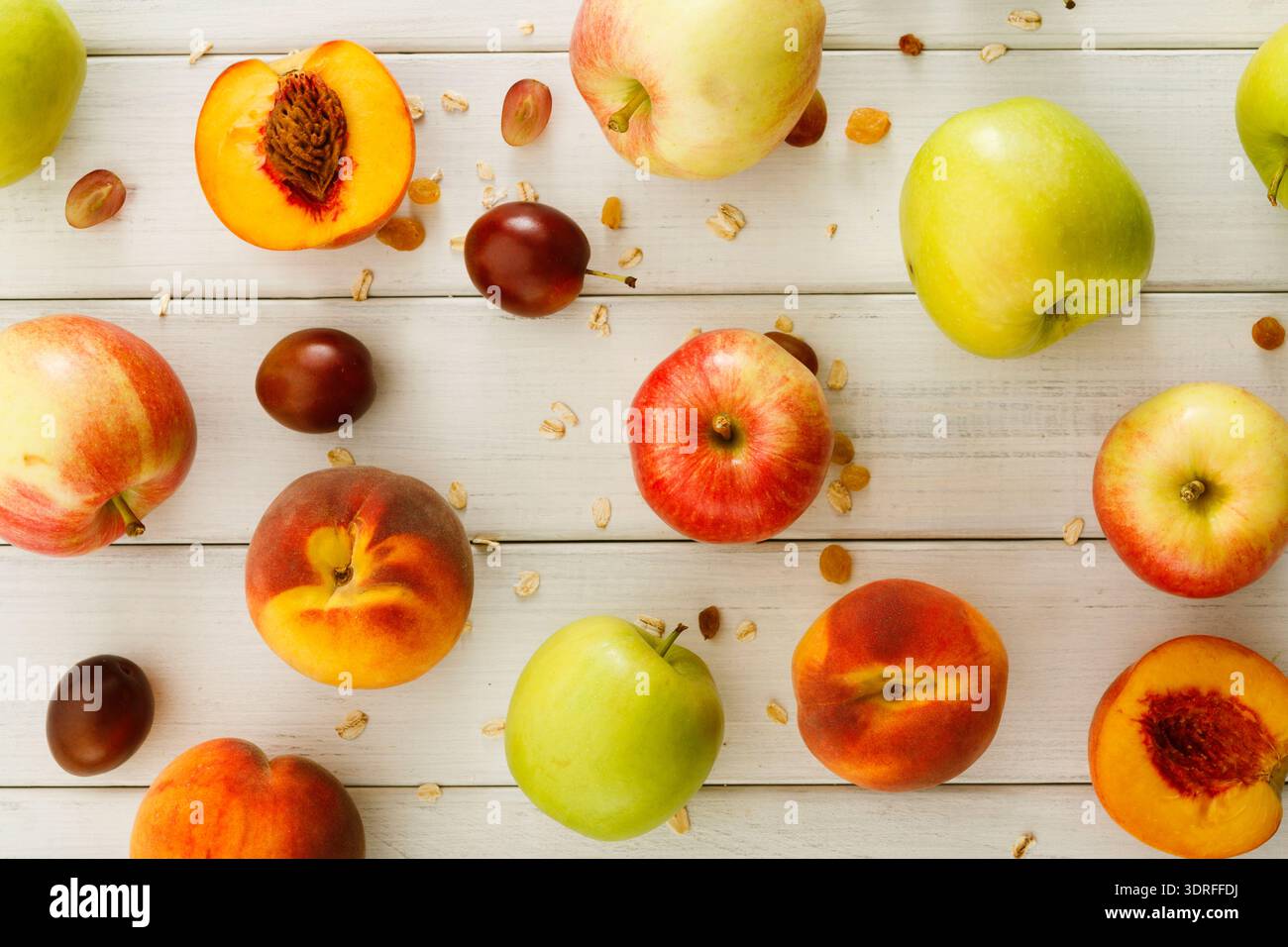 Collection of Various Fruits on a Wooden Table Arranged in a Colorful Display Stock Photo