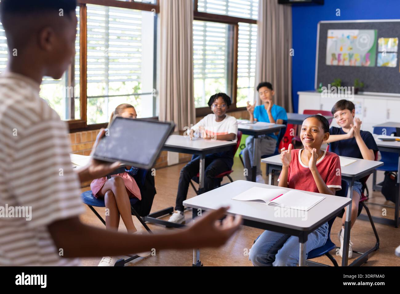 Project Presentation Classroom Presenting project on tablet, student engaging classmates in school ...