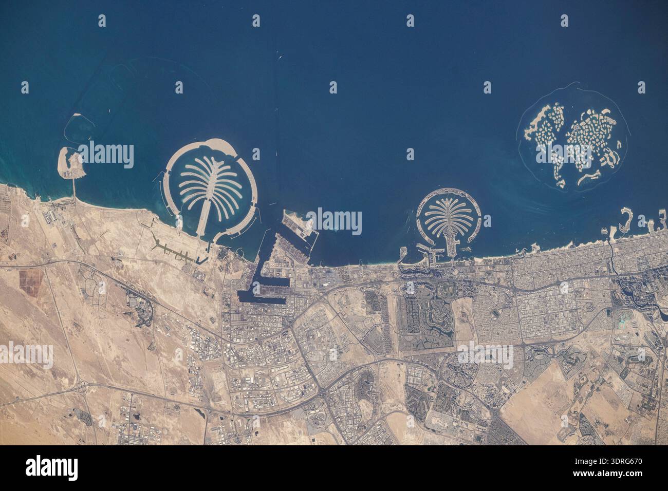 Artificial islands built on the Persian Gulf coast of Dubai, United Arab Emirates, are pictured from the International Space Station as it orbited 258 miles above the Arabian Sea. Featured promoniently from left, are the man-made archipelagos of Palm Jebel Ali, Palm Jumierah, and The World islands.  A photograph taken from the International Space Station on 10 June 2025.  An optimised version of an original NASA image: Credit NASA/NAyers Stock Photo