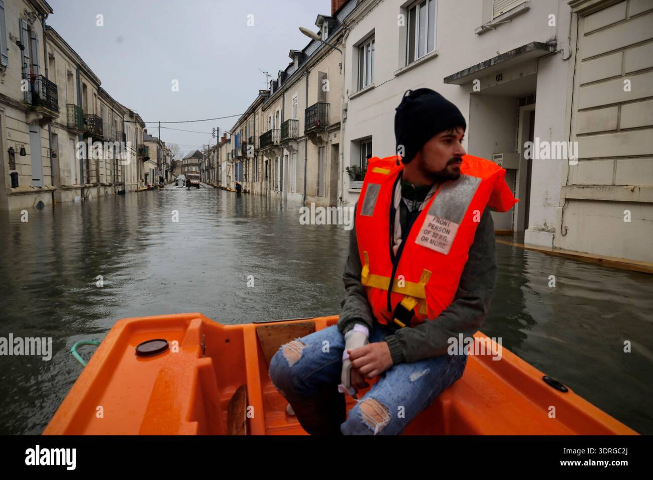 A man is evacuated in Saintes as severe flooding hits western France ...