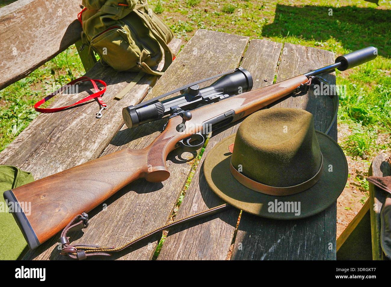 Hunting rifle with silencer and telescopic sight Stock Photo