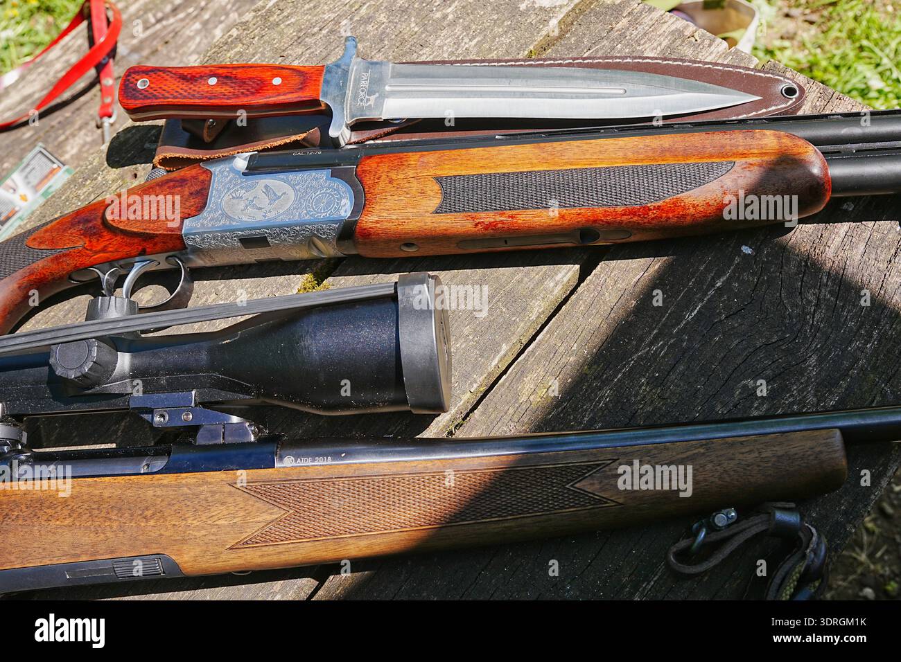 Hunting rifle with telescopic sight, shotgun and interceptor knife Stock Photo