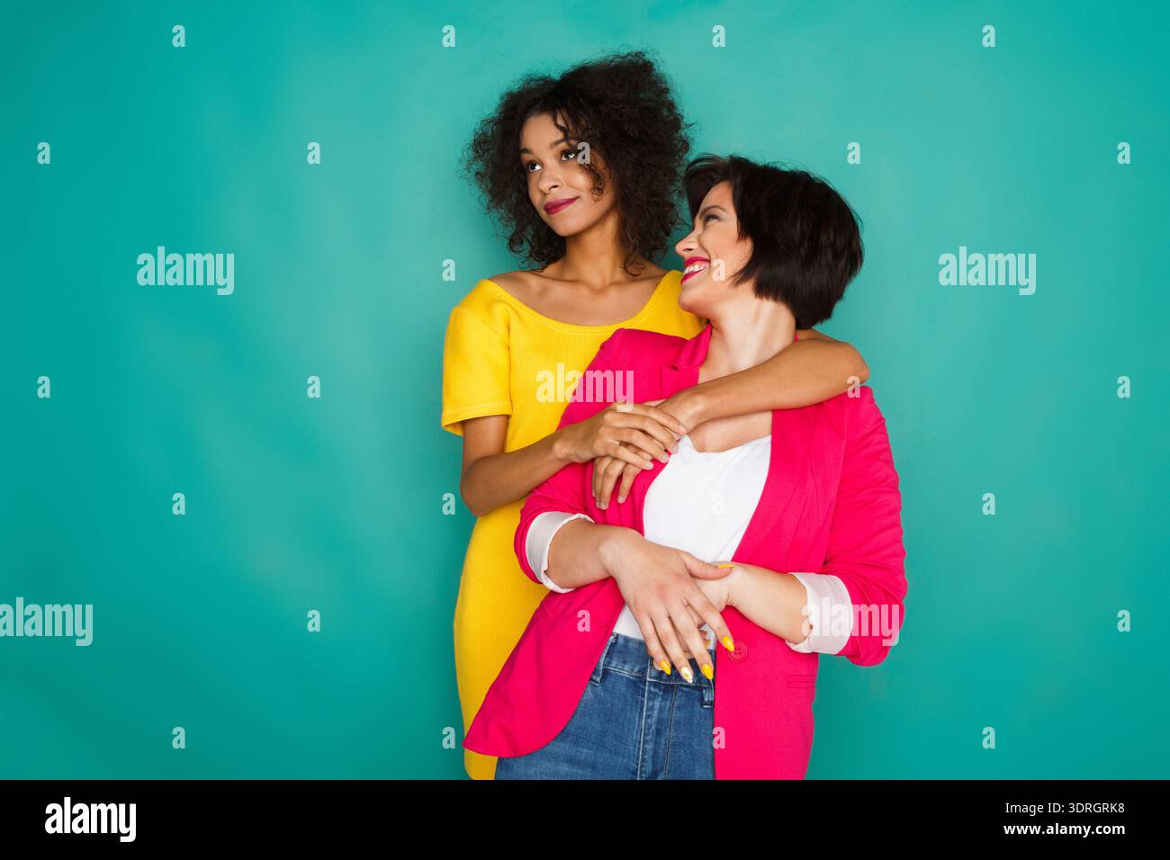 Two women standing together hi-res stock photography and images - Alamy